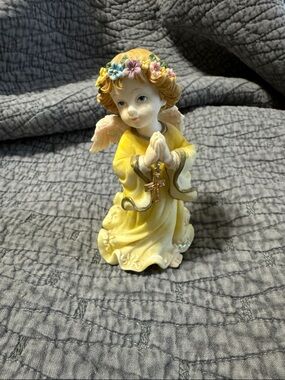Yellow Angel Figurine with Floral Crown and Cross Accent
